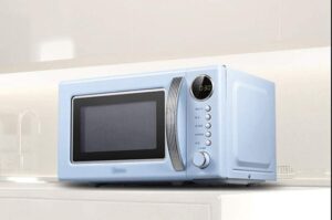 Forno a microonde da appoggio in stile retrò con giradischi e attivazione/disattivazione audio, design elegante per la tua cucina